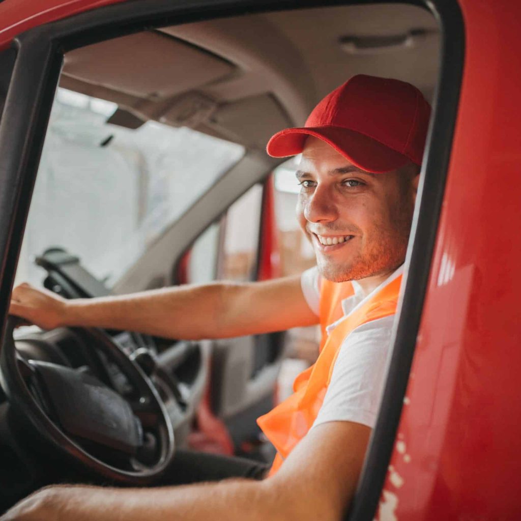 Delivery man driving van