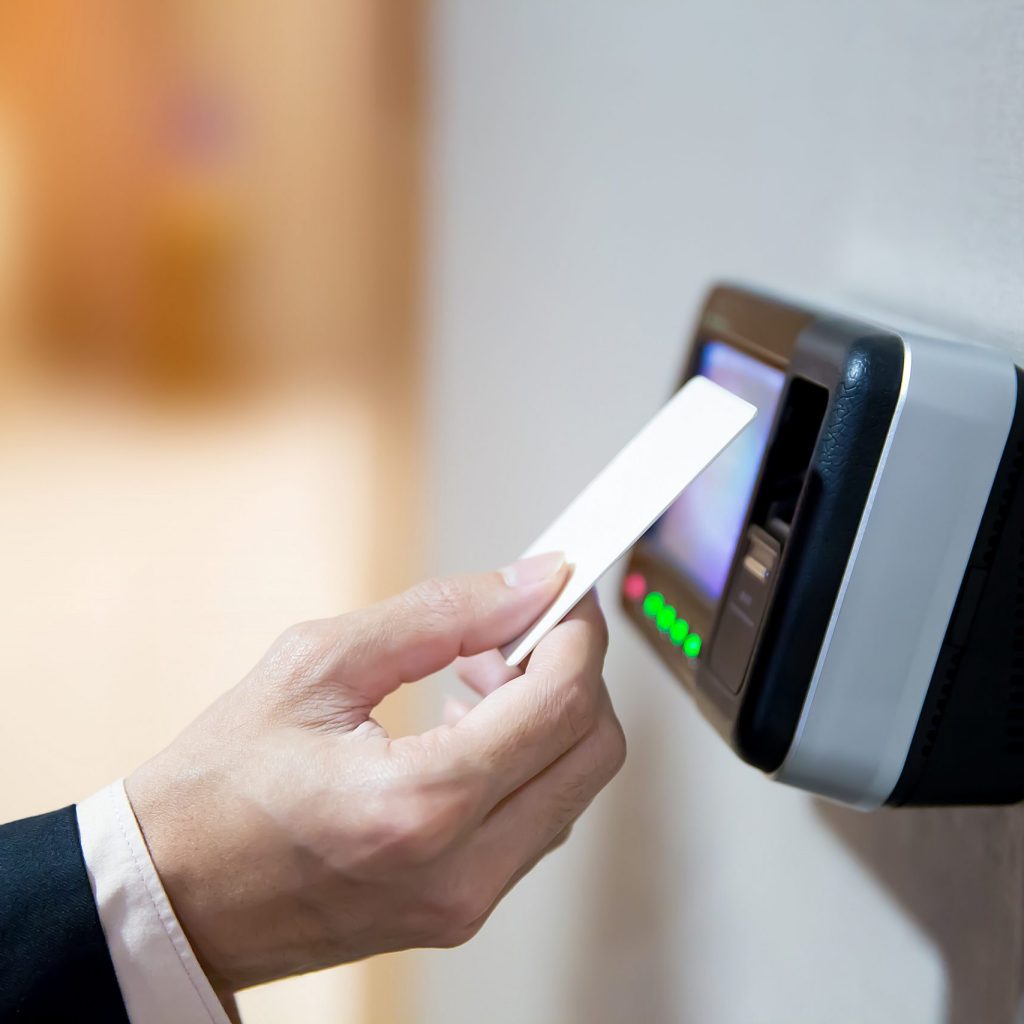 Engineers using key card to identity verification for access the door or entre the security room.