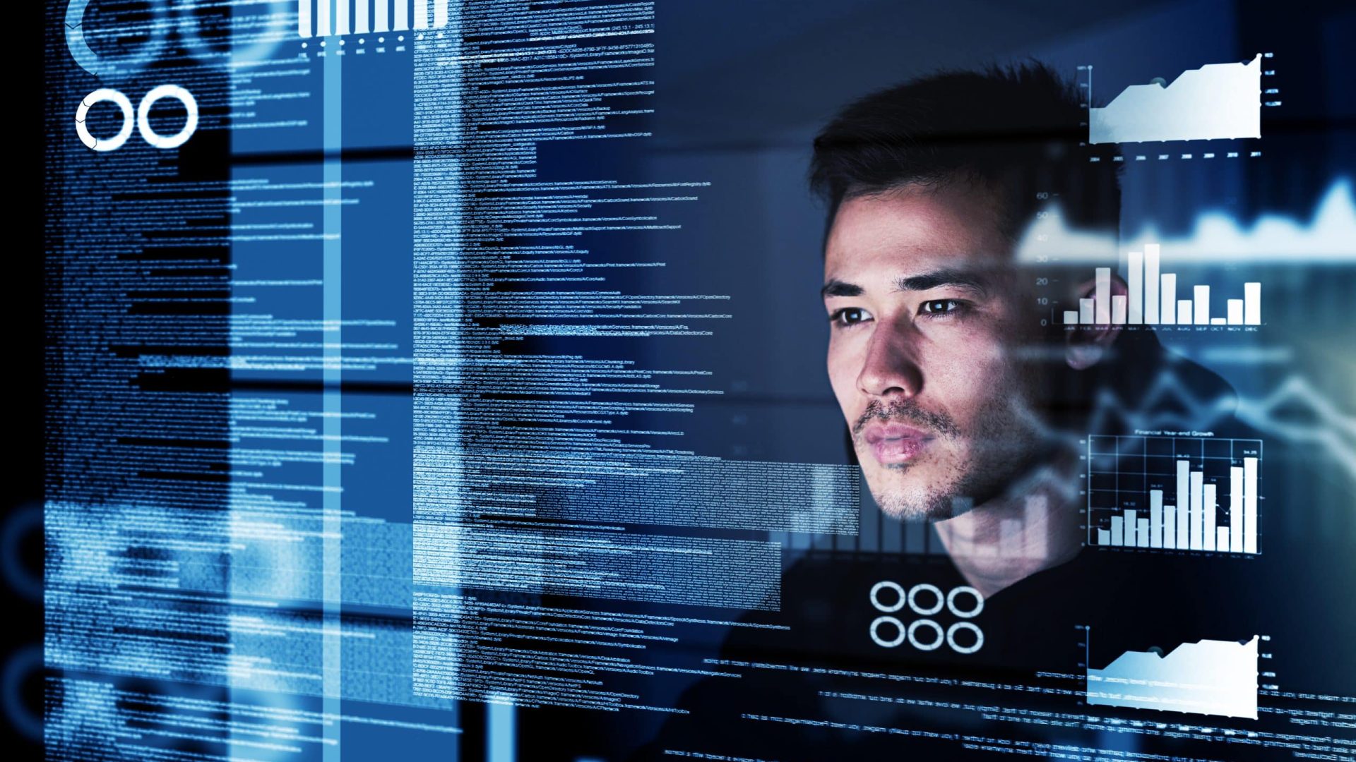 Shot of a focussed computer programmer working at his computer late at night