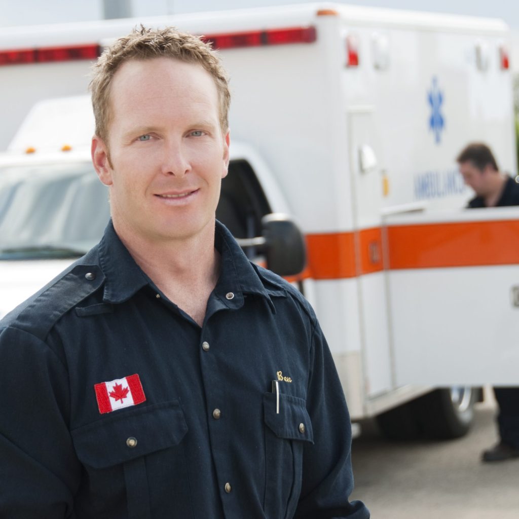 Public Safety Communications in Alberta Couple of Canadian paramedics with an ambulance.