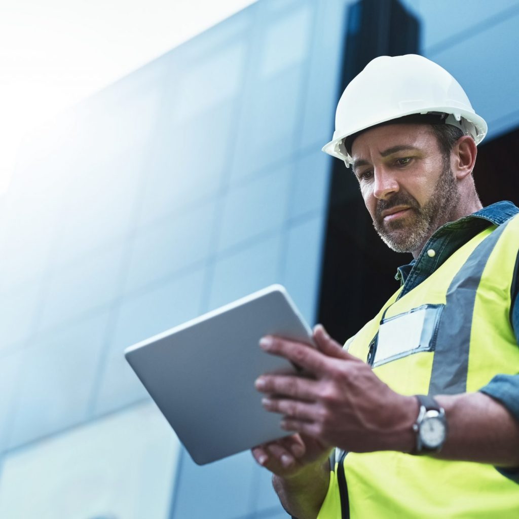 Shot of a engineer using a digital tablet on a construction site